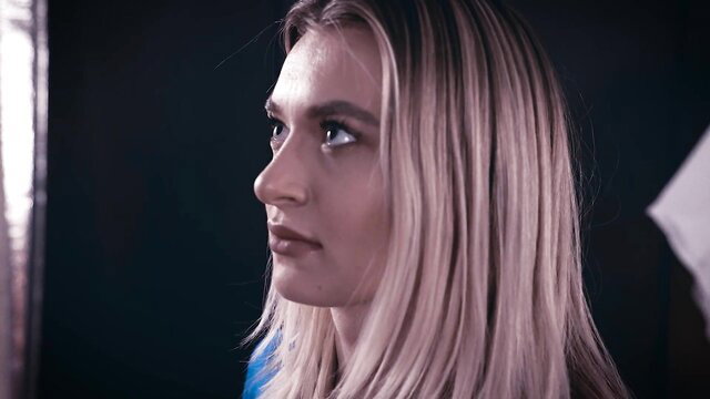 Blonde beauty with intense gaze in dramatic close-up, Broken adult video thumbnail