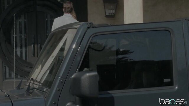 Lena Paul by black Jeep at mansion entrance, sexy outdoor tease