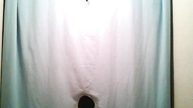 Amateur woman bent over from behind, huge round ass in white curtain hole