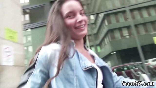 Slim Anita smiles in denim jacket on German Scout casting street