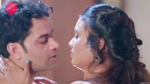 Indian couple intense close-up kiss, man gripping woman's neck passionately