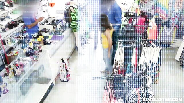 Skyler Storm in colorful store with Dorian Del Isla adult scene