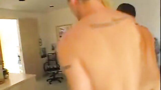 Cassie Young nude with tattooed muscular man in bedroom