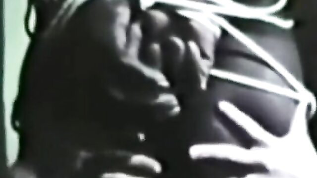 Black retro pornstar bound in white ropes, groped by hand on big ass