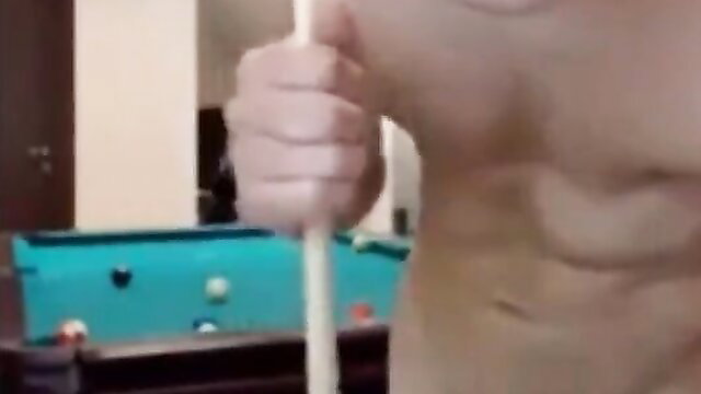 Closeup of man gripping thick white pool cue by turquoise pool table