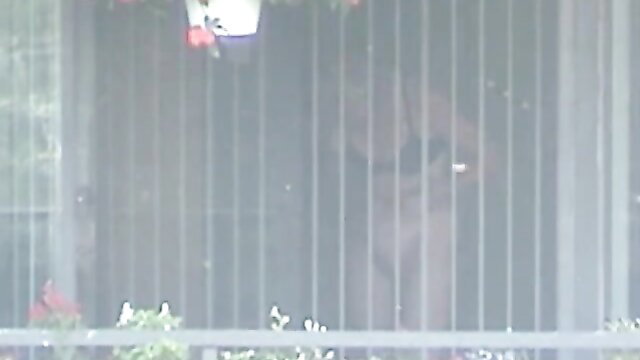 Slim blonde neighbor naked thru window bars in apartment