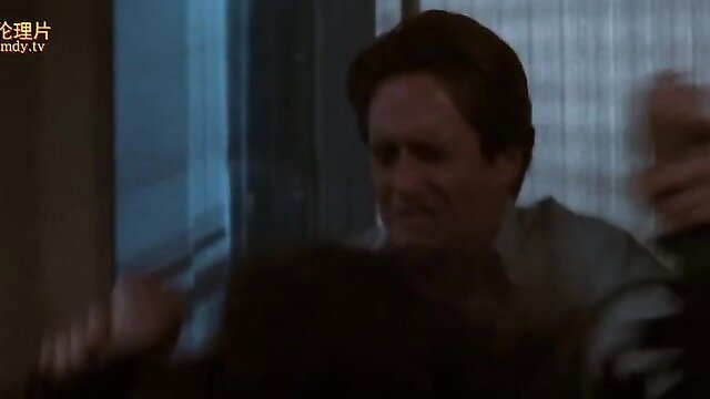 Paul Verhoeven movie scene: man grabs woman passionately in tense embrace