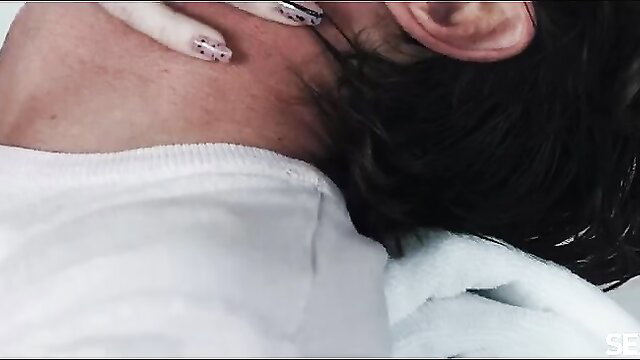 Closeup of woman's hand with white nails gripping man's neck in intimate moment