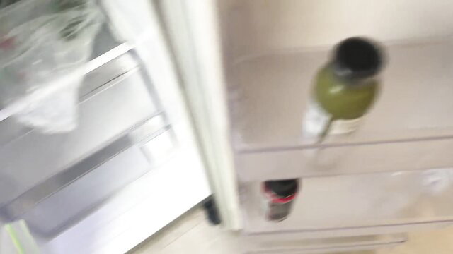 Macy Meadows green bottle tease in kitchen fridge POV