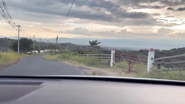 Scenic drive view in rural mountains at sunset