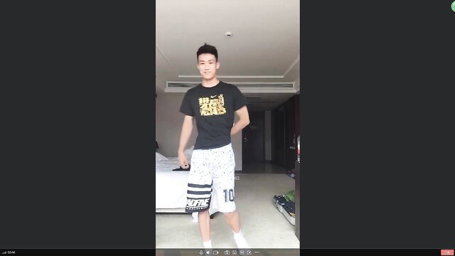 Asian athletic guy in white shorts and socks, bulging crotch, hotel pose