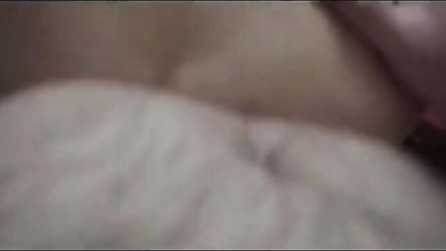 Blonde woman nude on bed after massage, big tits exposed