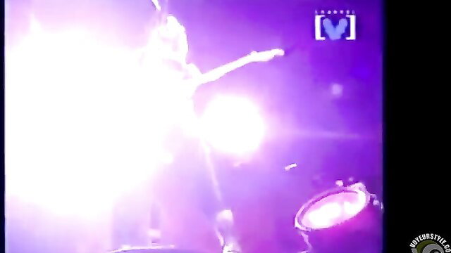 Hot topless rockstar chick shreds guitar on stage with boobs out