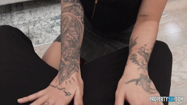 Adria Rae shows off her inked arms and fake tits in tight black leggings