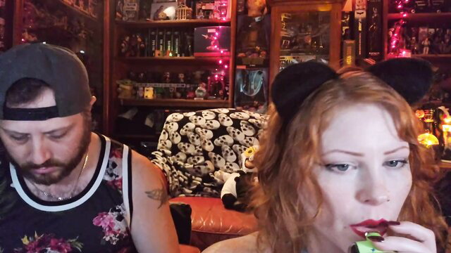 Lilbatt redhead with cat ears in tank top, guy beside her in Chaturbate show