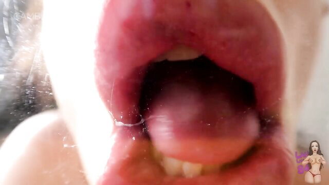 Closeup of woman's open mouth and tongue in Lahlah Kiss Mommy 2
