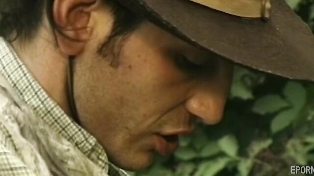Retro short-haired mature man in hat and shirt, garden outdoor scene