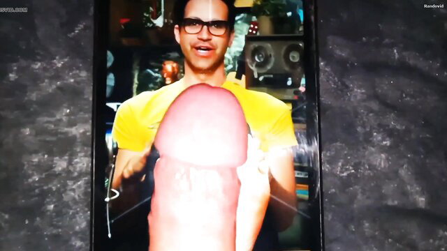 Muscular Latino man in yellow tank top flashing huge erect cock closeup