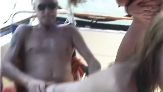 Bald tatted guy with hot blonde in FFM threesome on boat