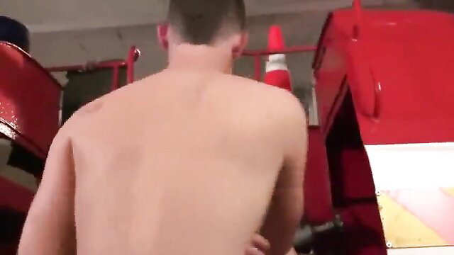 Shirtless muscular man Luis Bigdog by fire truck in Monster Wood Inferno