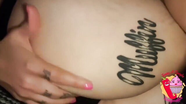 Woman showing off her tattoo