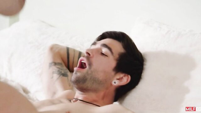 Jenna Starr rides handsome tattooed guy in bed, hot MILF action