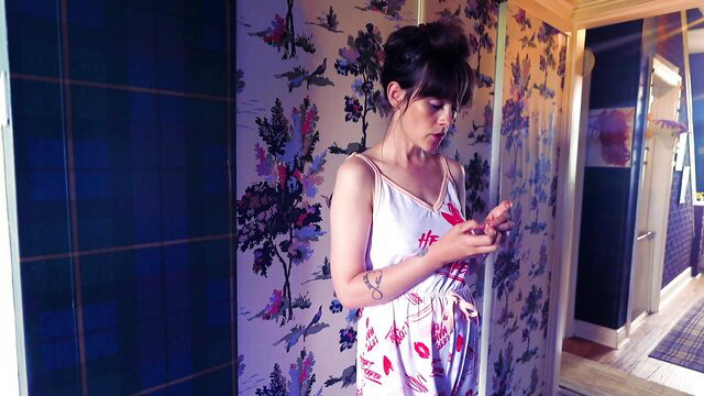 Sydney Harwin in sexy white floral slip dress, texting in bedroom