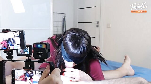 Blindfolded Asian babe in homemade MFM threesome blowjob