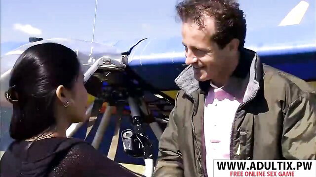 Libellule chats with man by plane in outdoor adult scene