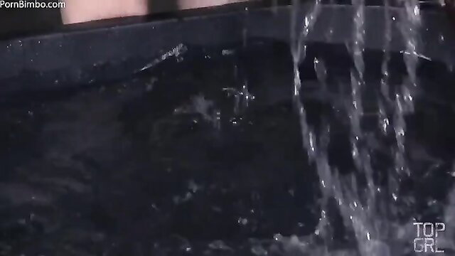 Violet Monroe dipped in water tank, wet strapon play by Rain De Grey