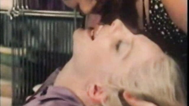 Vintage lesbian salon scene with blonde caged head kiss, Pussycat 501