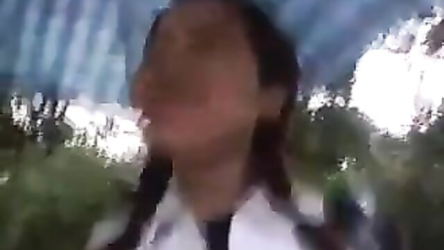 Japanese girl in white coat squats outdoors for piss action