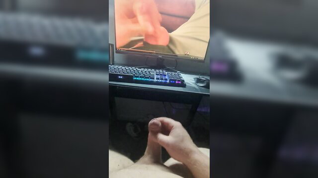 GermanDick35 jerks off to porn on screen, handjob POV closeup