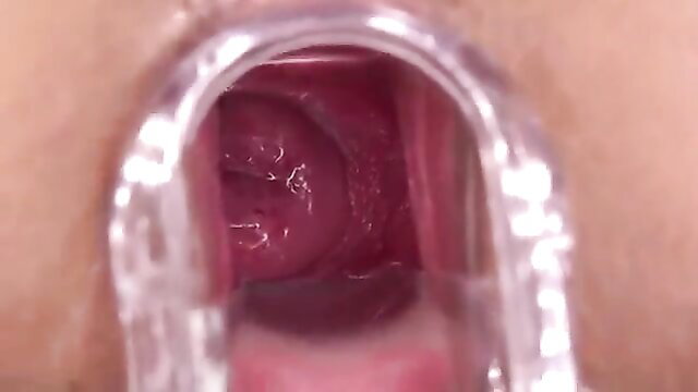 Close-up teen pussy spread wide by speculum, tight pink vagina exposed