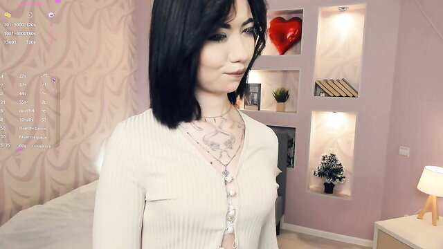 Queendutter shy Asian cam girl in open white cardigan, tattoos, hot Chaturbate tease