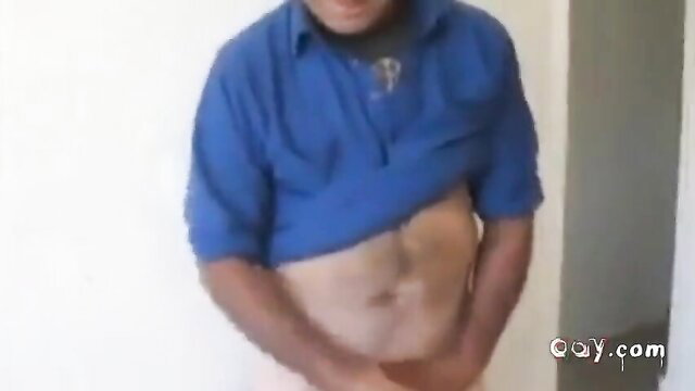 Chubby Indian dad lifts blue shirt exposing hairy belly and pink underwear bulge