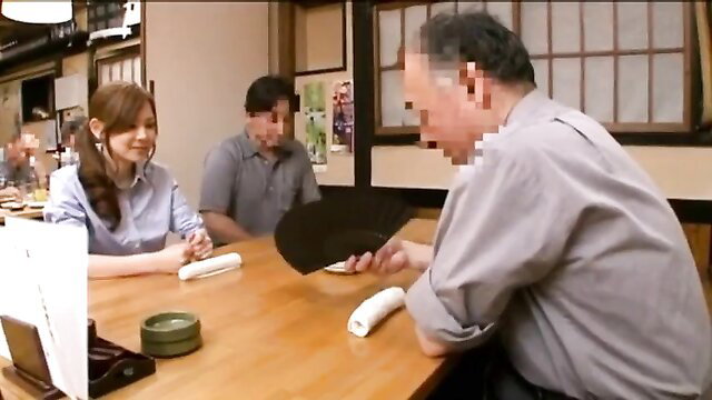 Asian daughter-in-law flirts with father-in-law at Japanese restaurant table