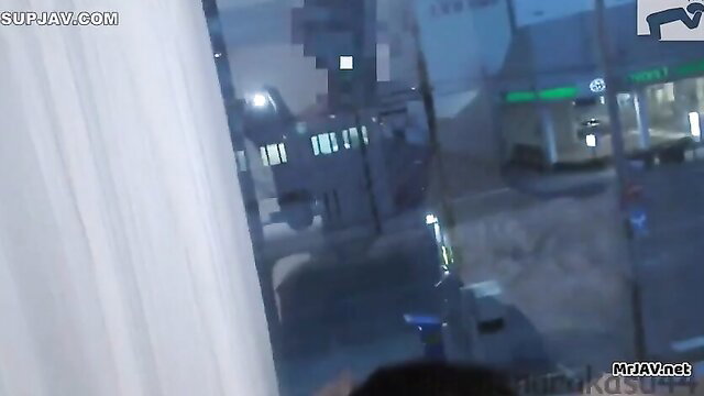 Blurry JAV thumbnail of urban night scene through window, no nudity visible