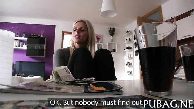 Blonde naughty cowgirl with cash and beer, teasing indoors