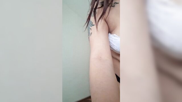 Hot Latina professor's sexy arm and tattoo in white lace bra