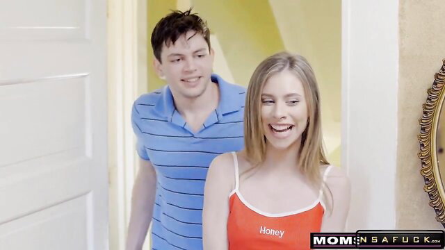 Blonde big tits MILF in tank top smiles with son at door on Mother's Day
