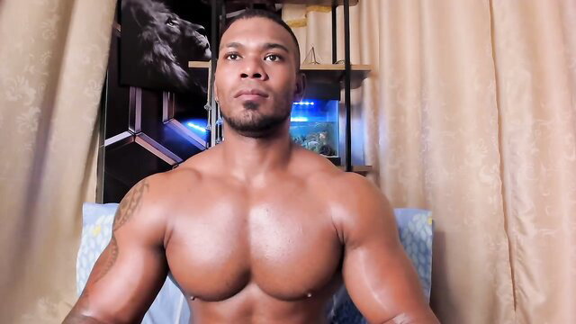 Muscular black gay hunk Tayler Waka shirtless flexing in amateur cam
