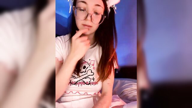 Raregirl petite Asian-Russian camgirl in skull tee with cat ears, teasing pose