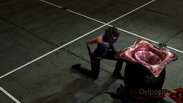 Woman in alien mask kneels before fleshy pink ovipositor monster in Resident Alien parody
