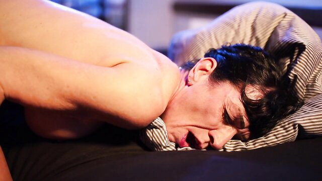 Bound sexy MILF gagged on bed, face in ecstasy, nude body arched