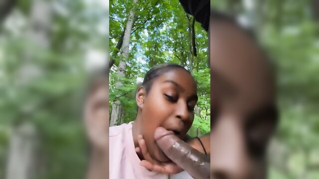 Black amateur babe deepthroating big black cock in forest outdoors