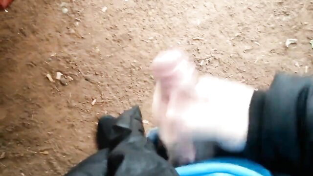 German stud jerks uncut cock in public park, handjob closeup