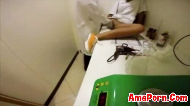 Hot Asian office girl in white robe spreads legs on table