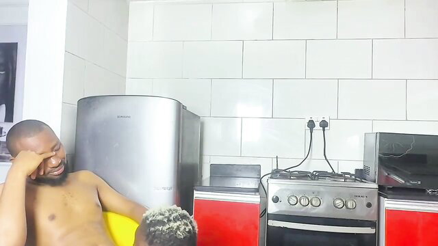 Nude black man laughing in kitchen grabs huge ebony cock