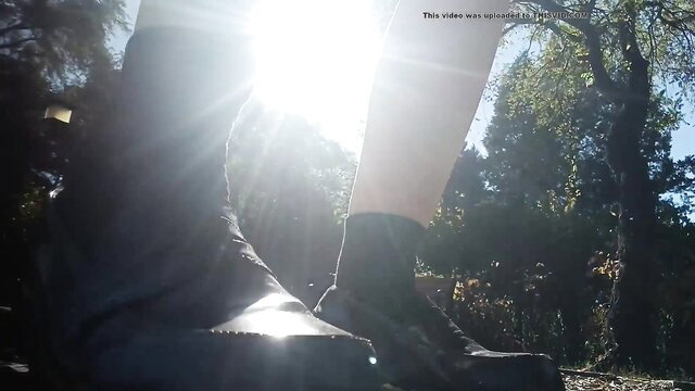 Giantess boots closeup in sunny forest, towering legs crush tiny world